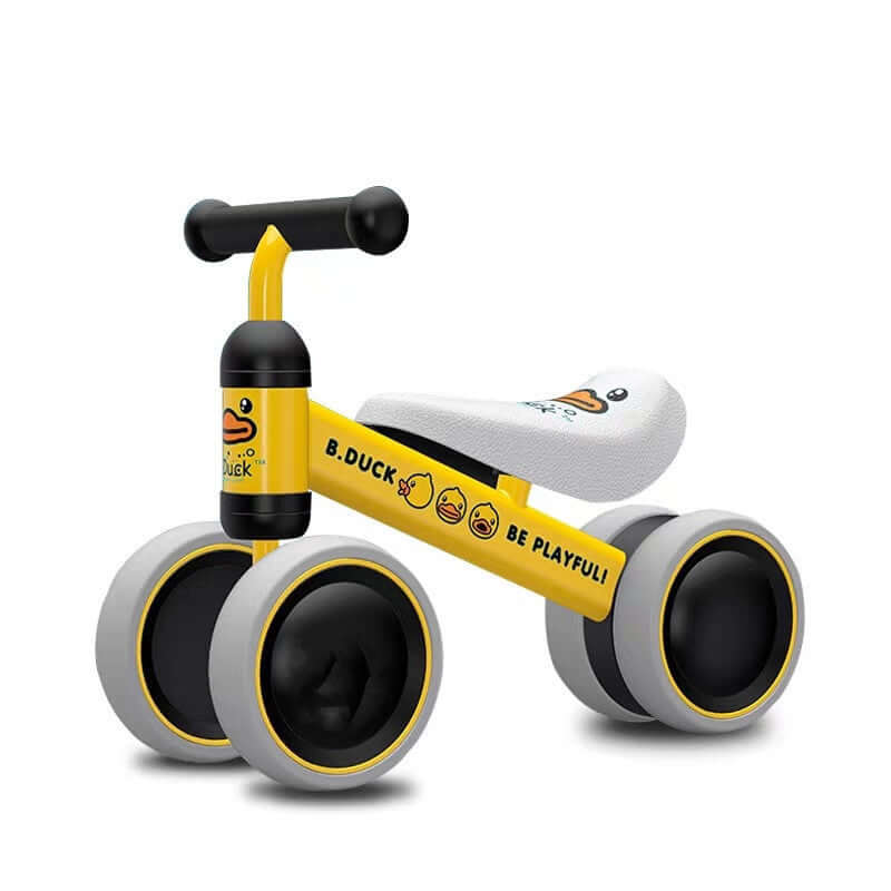 Yellow no-pedal baby balance bike with three wheels and duck design, featuring eco-friendly EVA foam tires and PU leather seat.